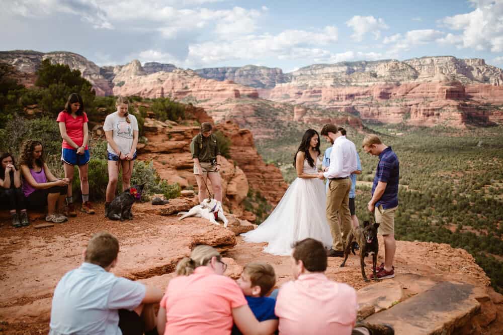 A couple prays at their wedding ceremony in Sedona.
