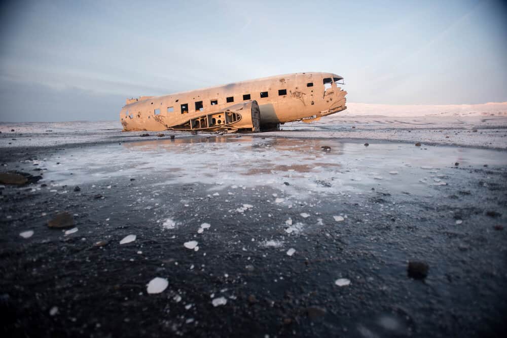 The crashed plane on the coast of Iceland on a Winter day. 