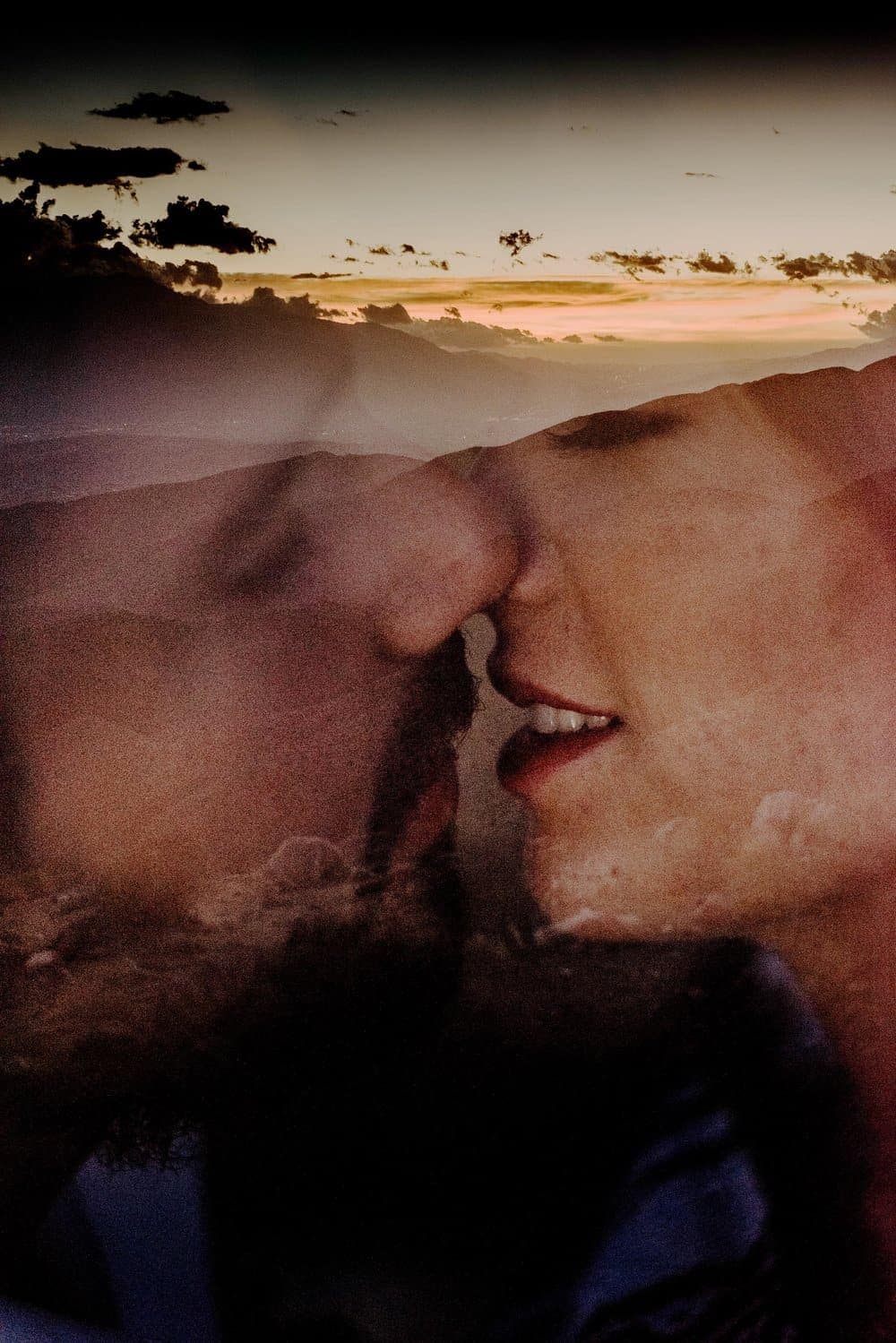 A romantic up close images of a couple almost kissing overlayed with the sunset at Keys view.