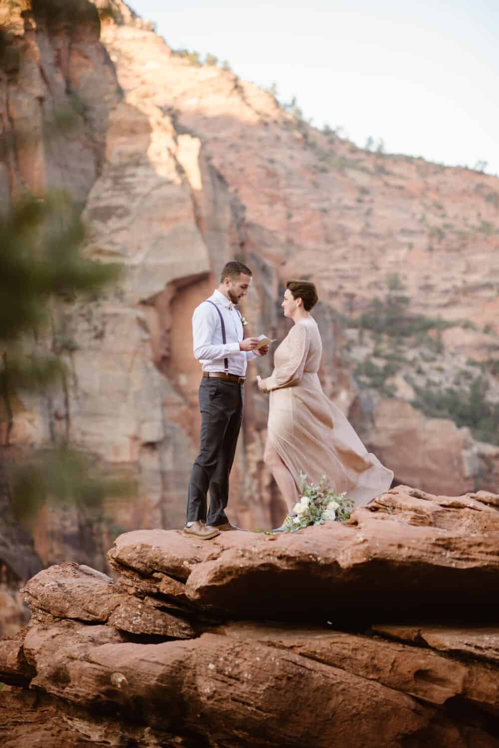 The bride and groom share vows with one another at a private vista overlook within Zion National Park