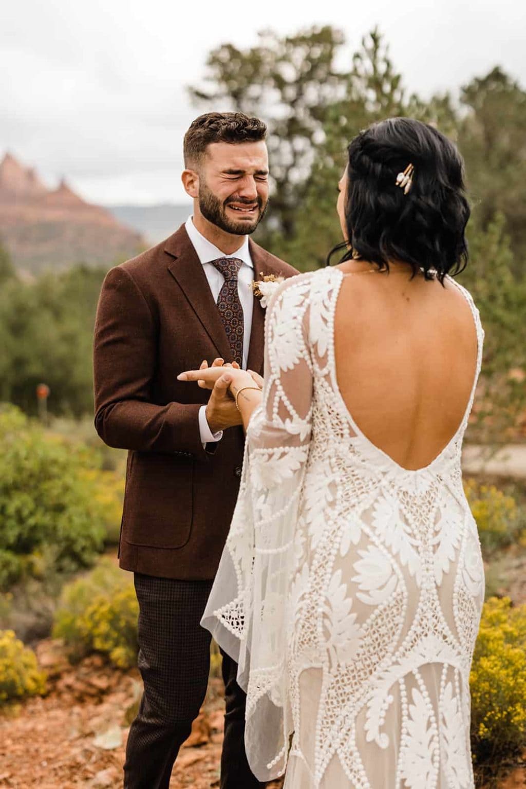 A bride and groom celebrating their first look in Sedona
