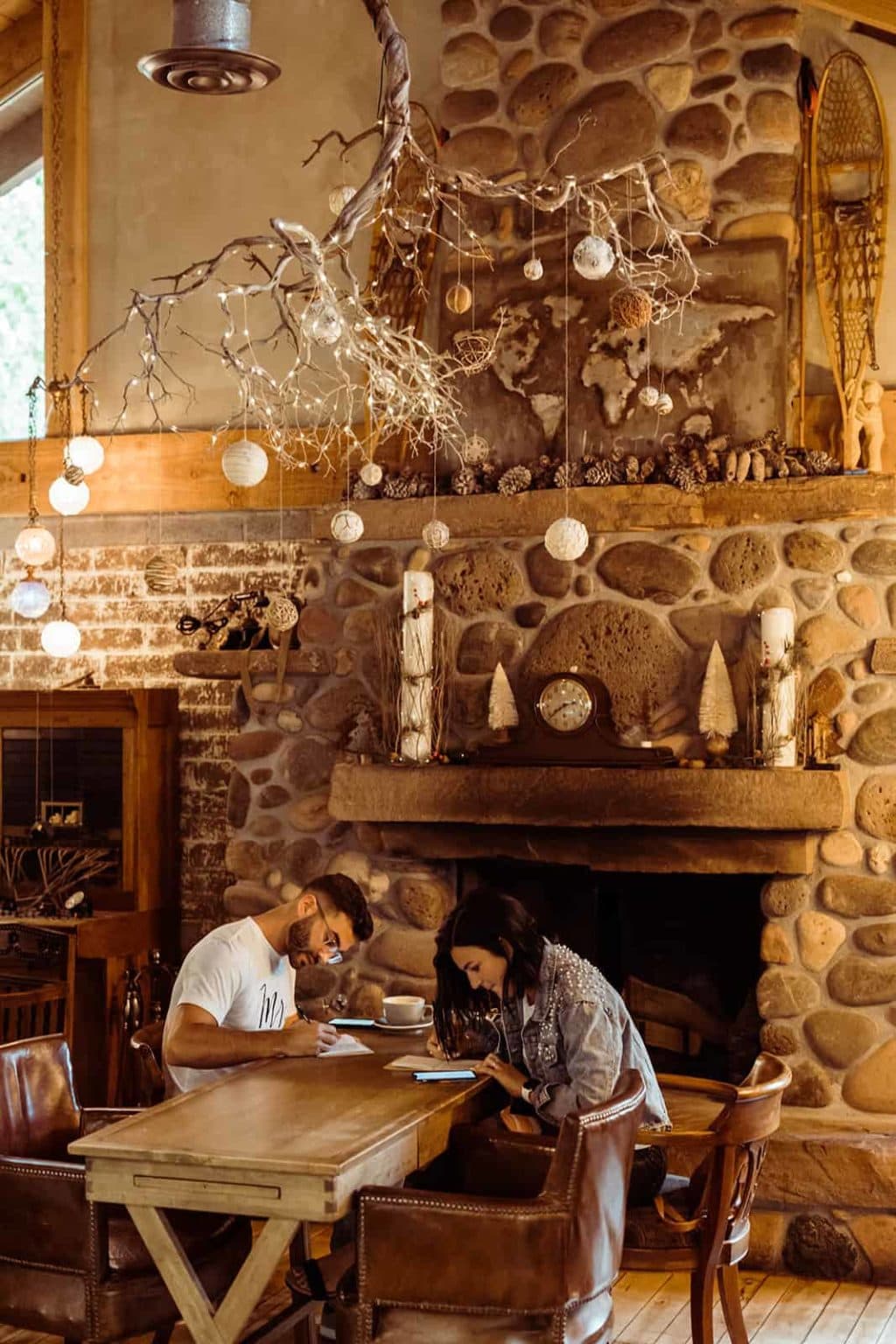 A bride and groom writing their vows together at a coffee shop in Sedona