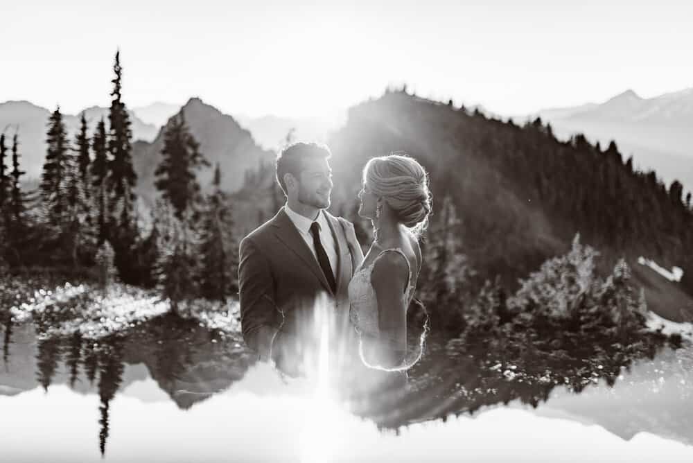A black and white image of a couple in a mountain area.