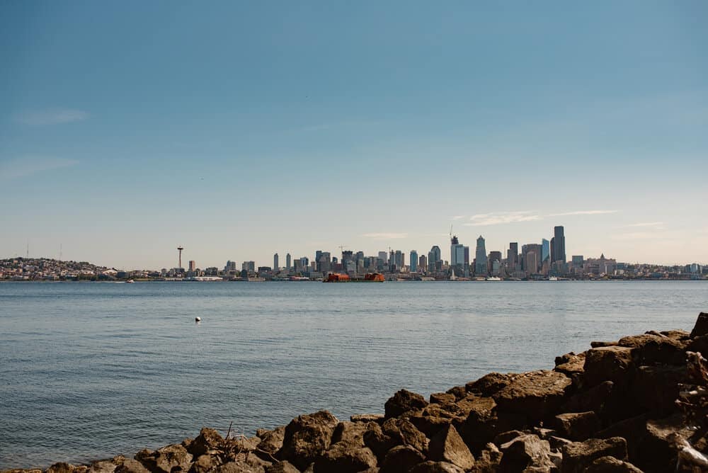 A landscape image of downtown seattle by the water. 