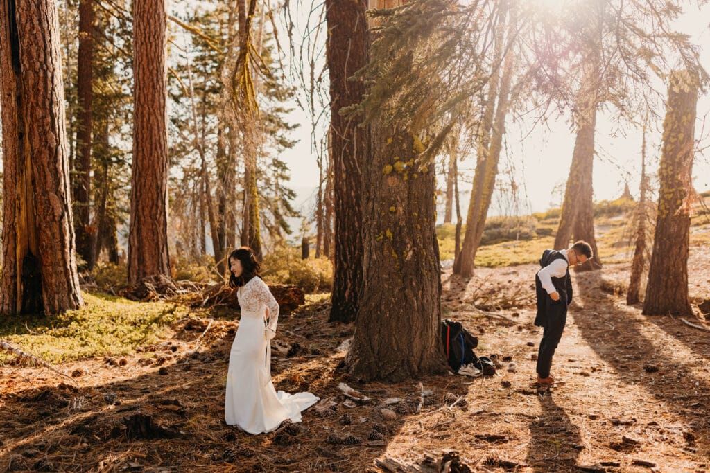 A bride and groom get ready together out in nature for their elopement without seeing each other. 