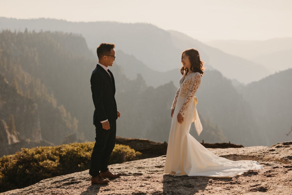 A bride and groom share a first look at Taft Point. 