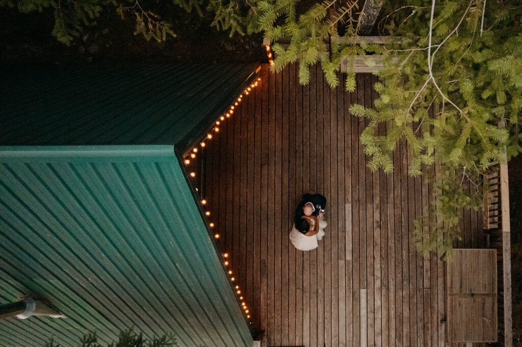 A drone photo of the couples first dance at the cabin.