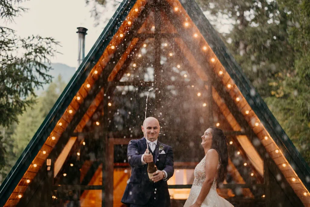 A couple celebrates their wedding day at a beautiful cabin in the woods.