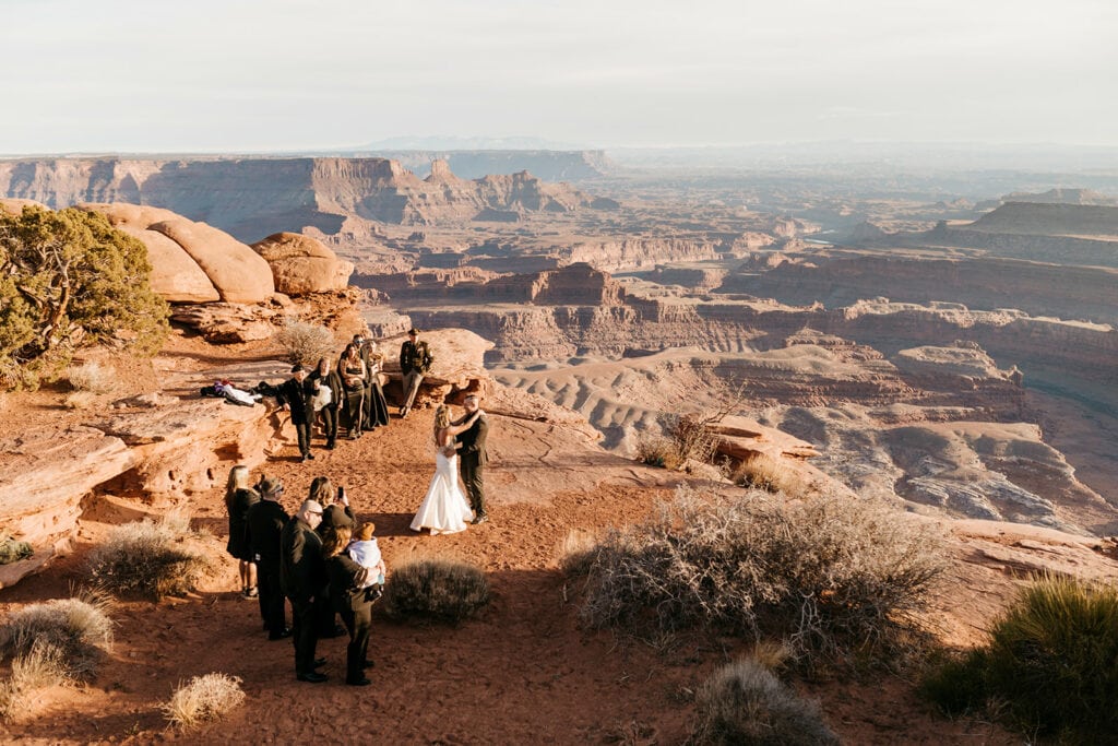 A couple shares their first dance in the desert. 
