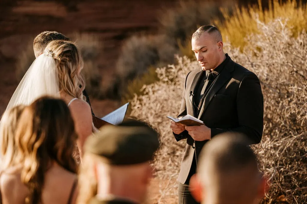 The groom reads his vows to his soon to be wife. 