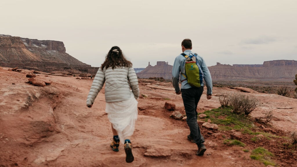 The couple hikes together to their ceremony.