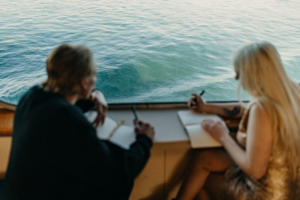 A couple writes their vows on the ferry. 
