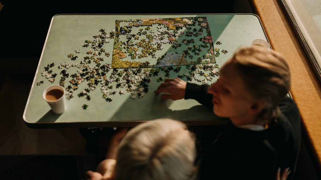 A detail photo of the puzzle the couple is doing. 