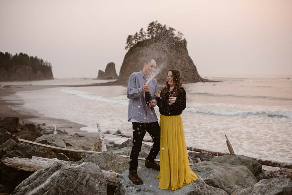 A couple celebrates their engagement at Rialto Beach 