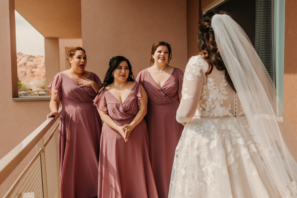 The bridesmaids see the bride for the first time.