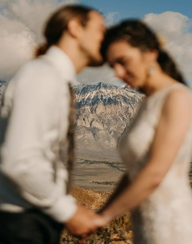 A couple shares an intimate moment during their elopement in Bishop, CA
