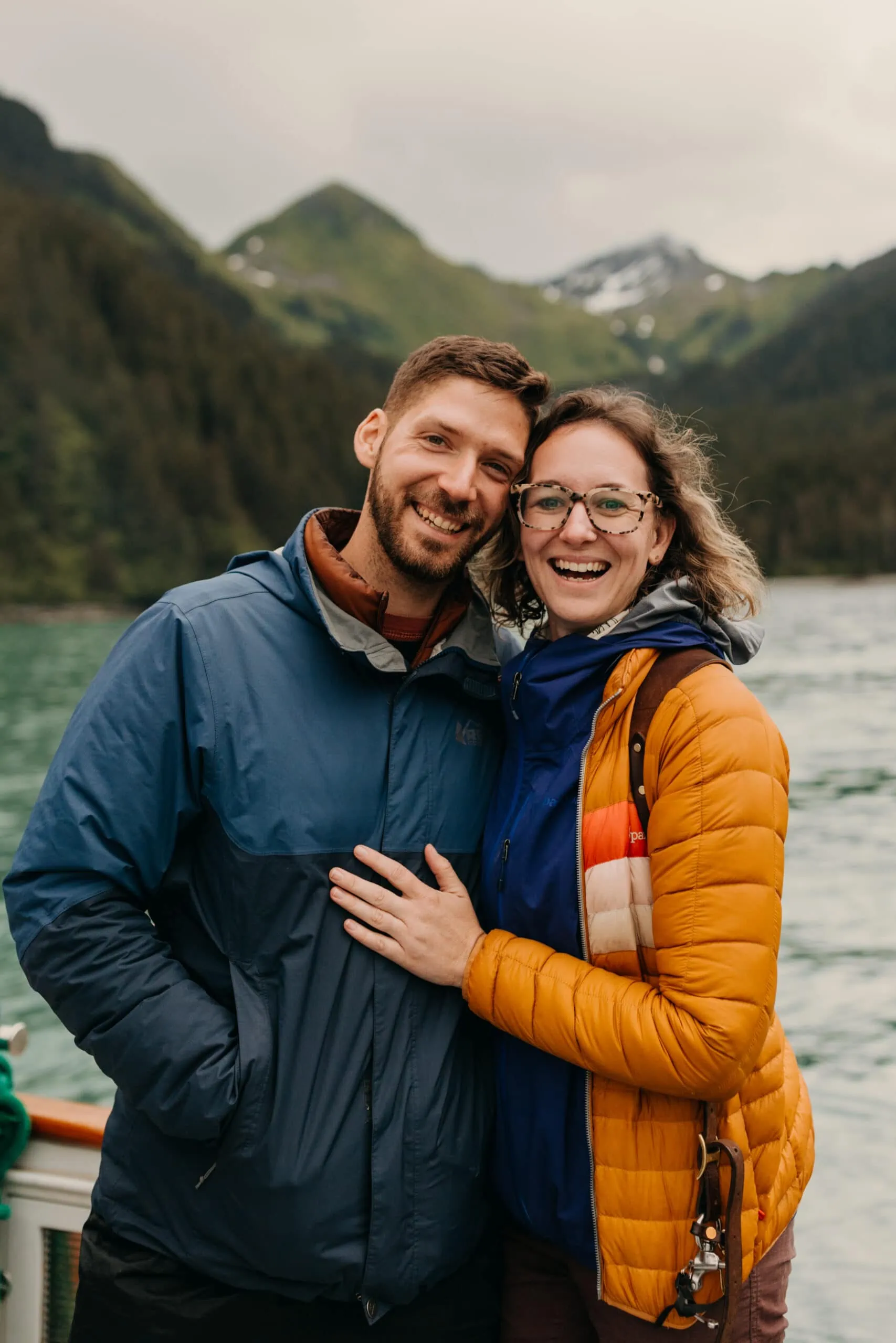 A portraits of a couple adventuring in Alaska in the bay.