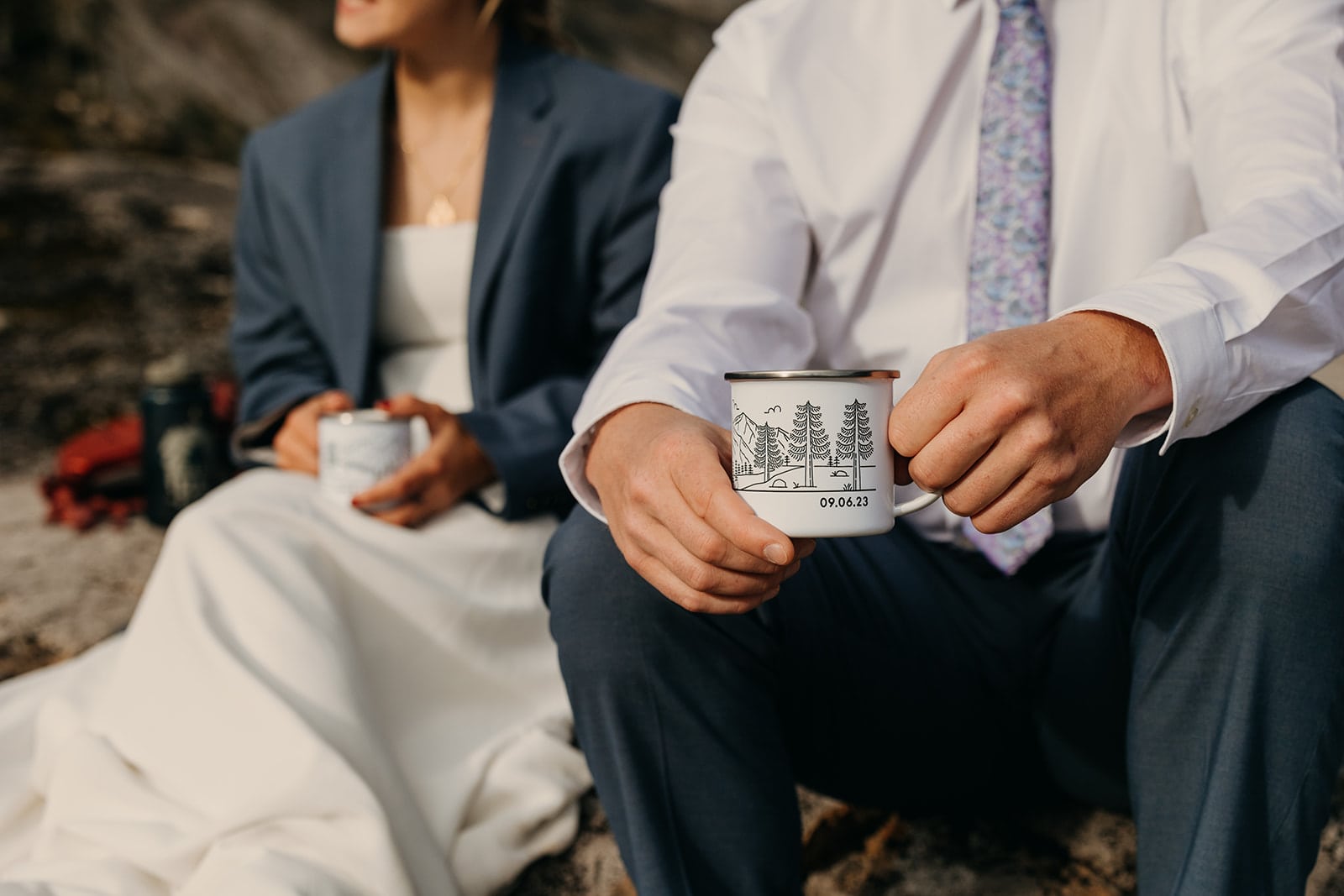 The couple enjoys coffee in their camp mugs.