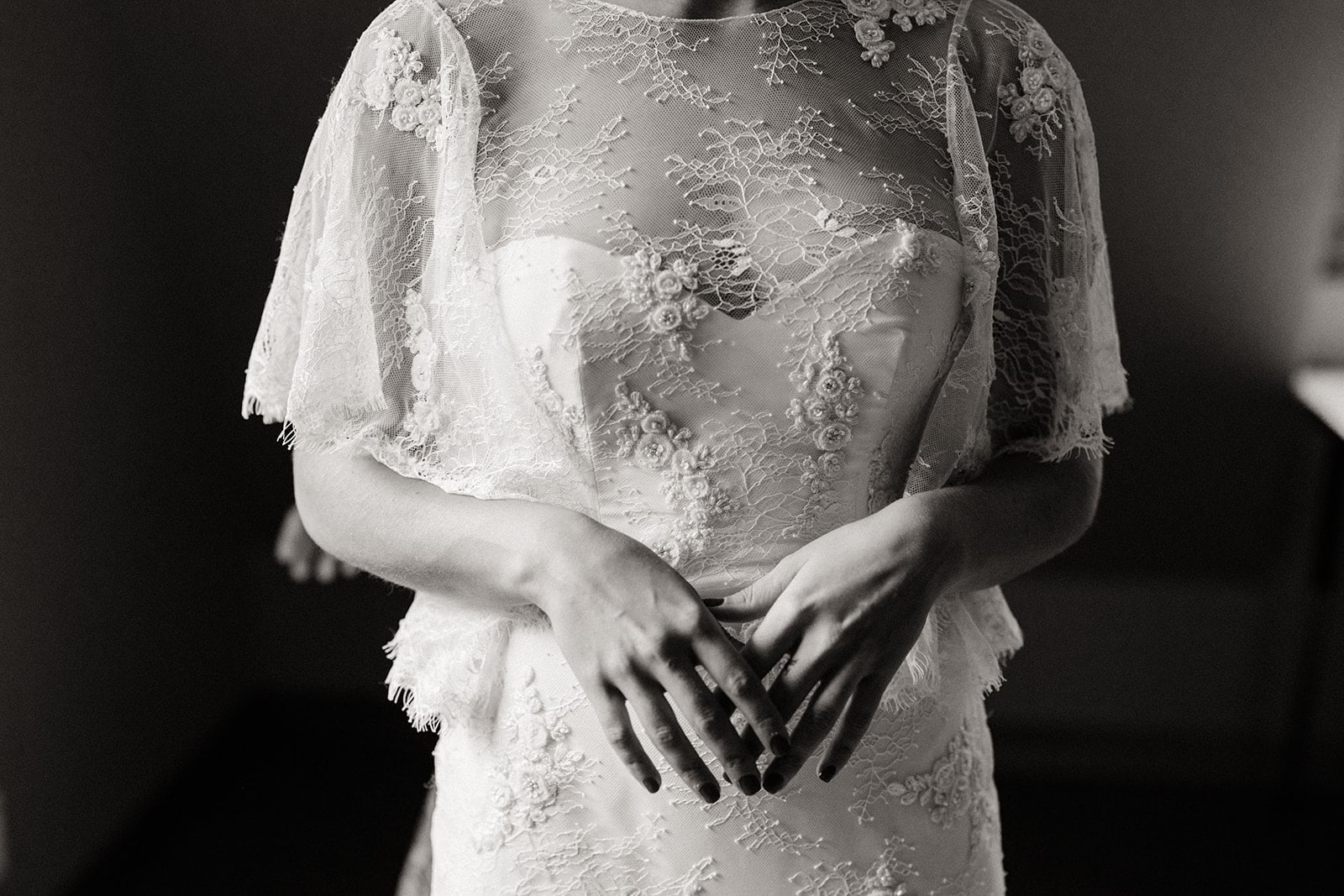 A black and white detail of the brides second dress.