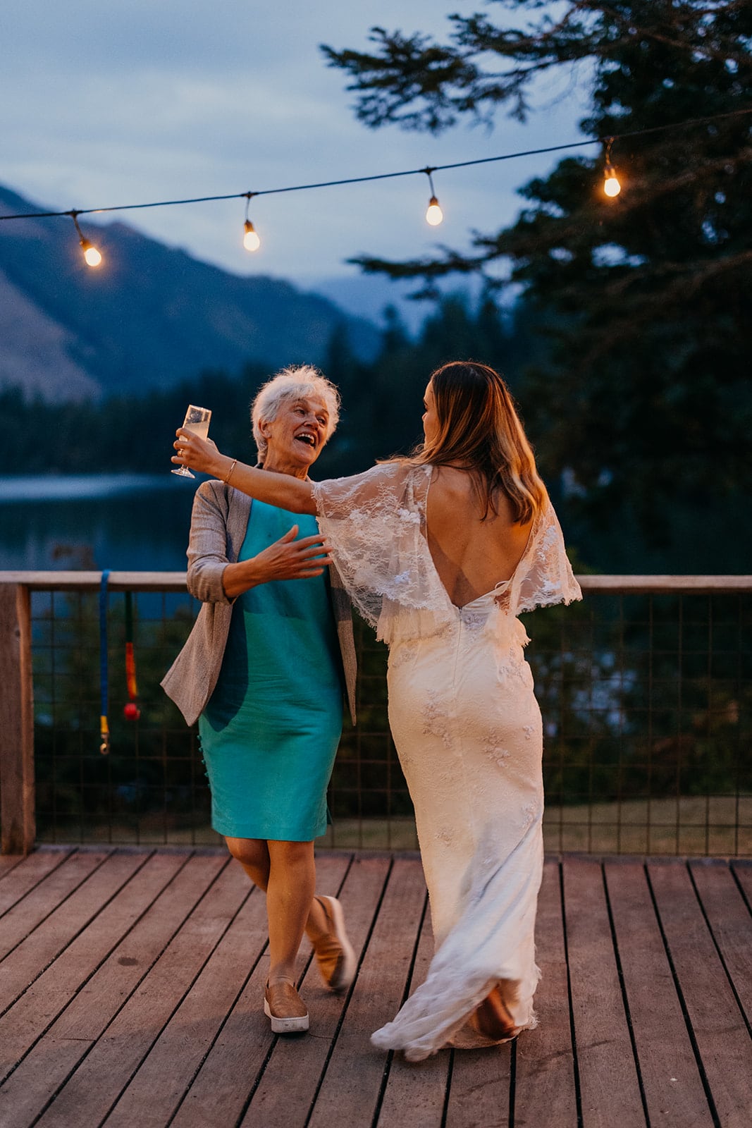 The bride dances with her mom.