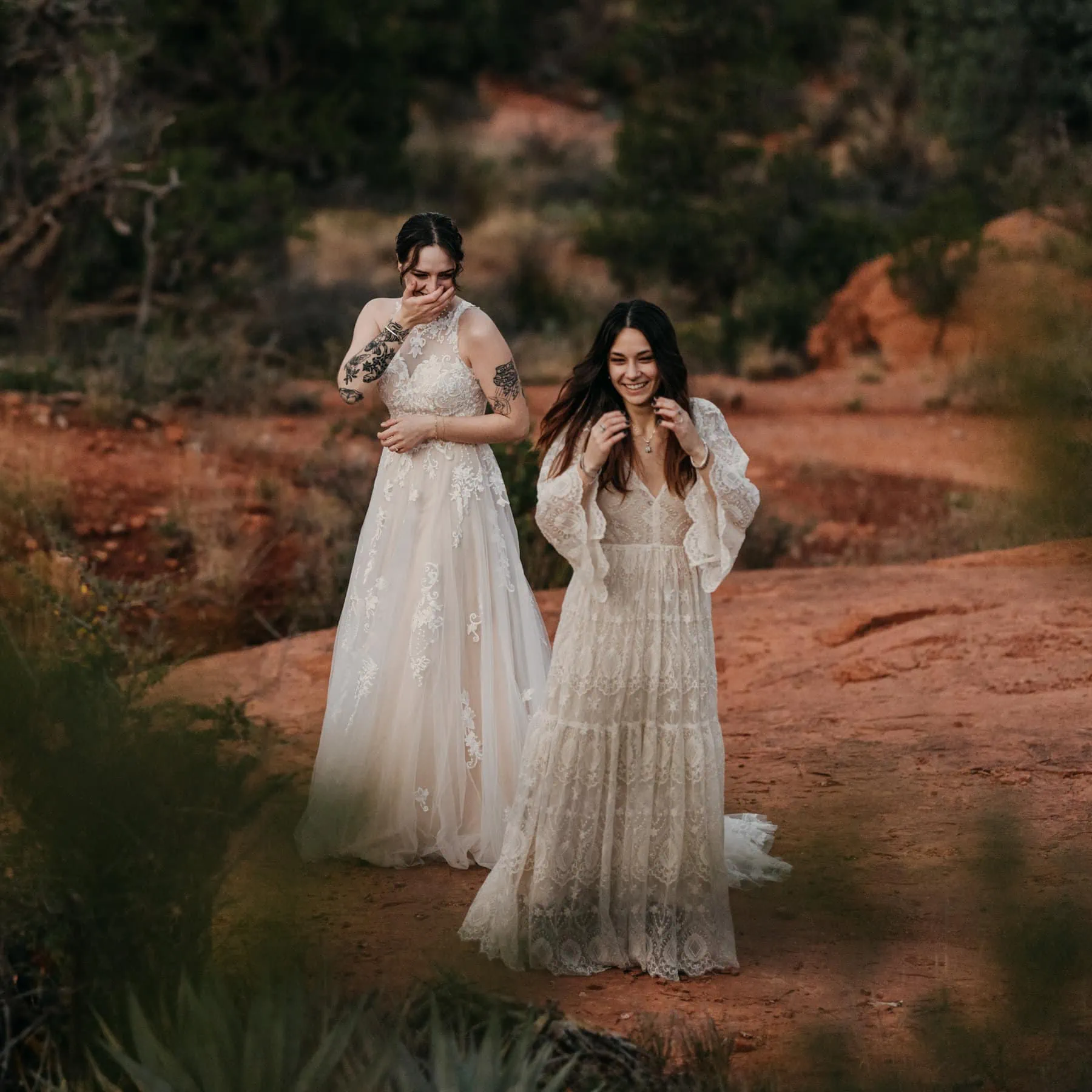 Two brides share a first look in the desert together.