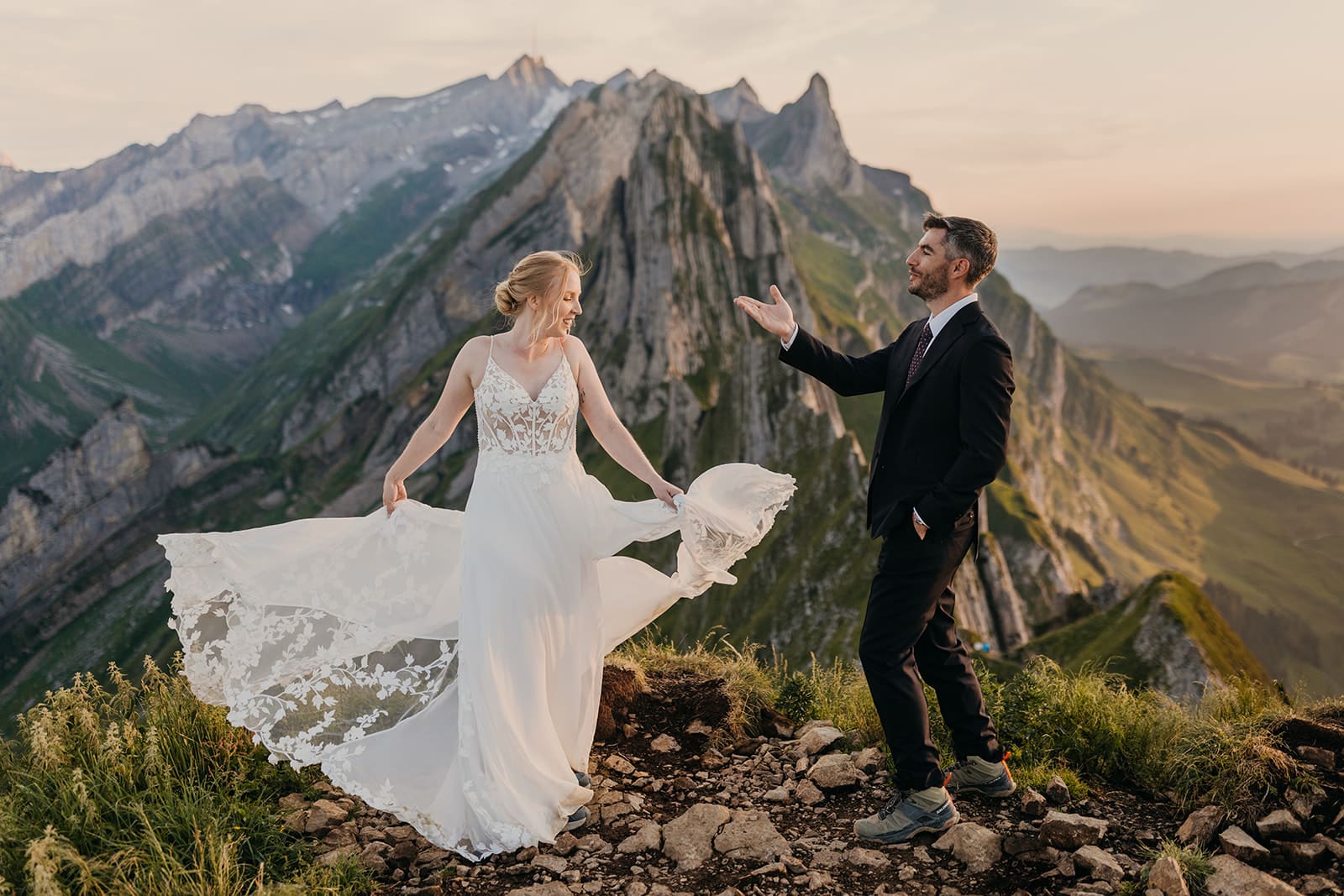 A groom blows his bride a kiss.