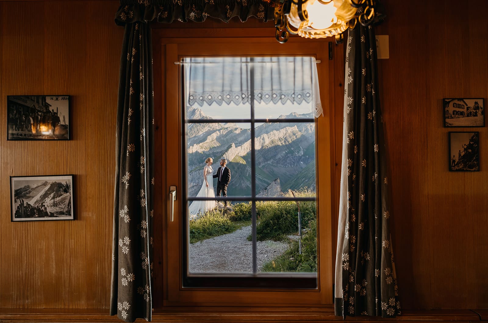 A couple photographed from inside the mountain hut.