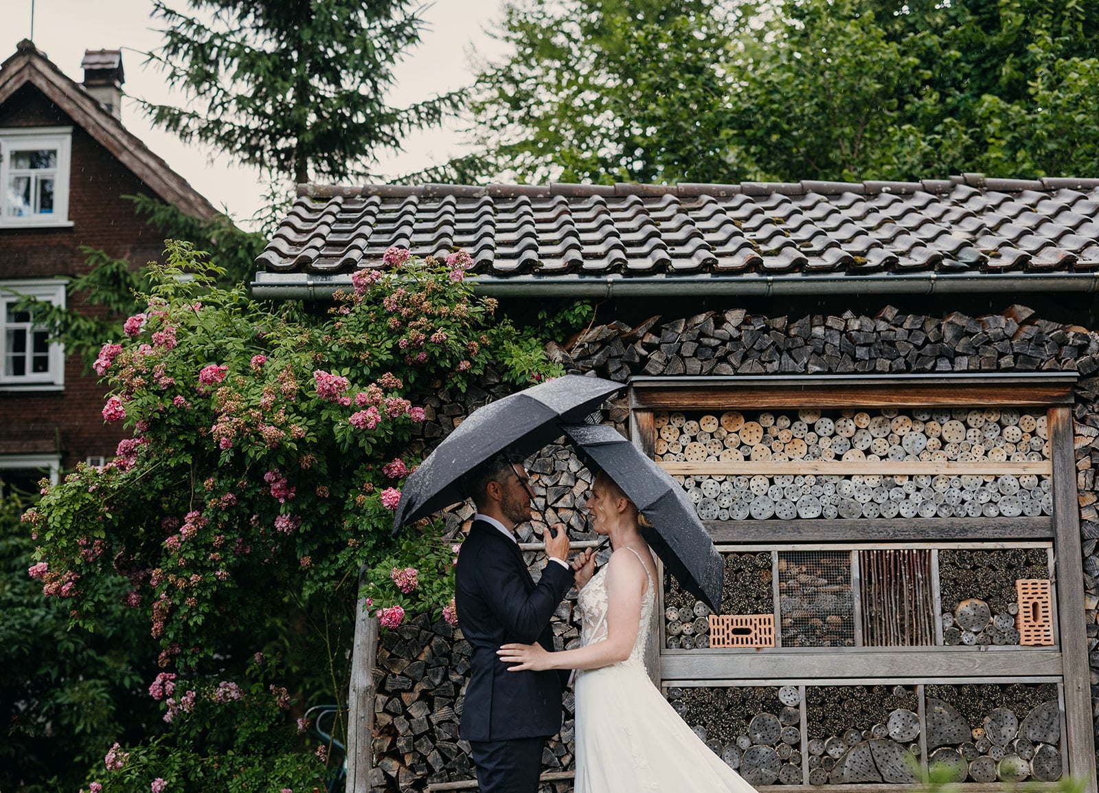 A couple shares a first look in a garden.