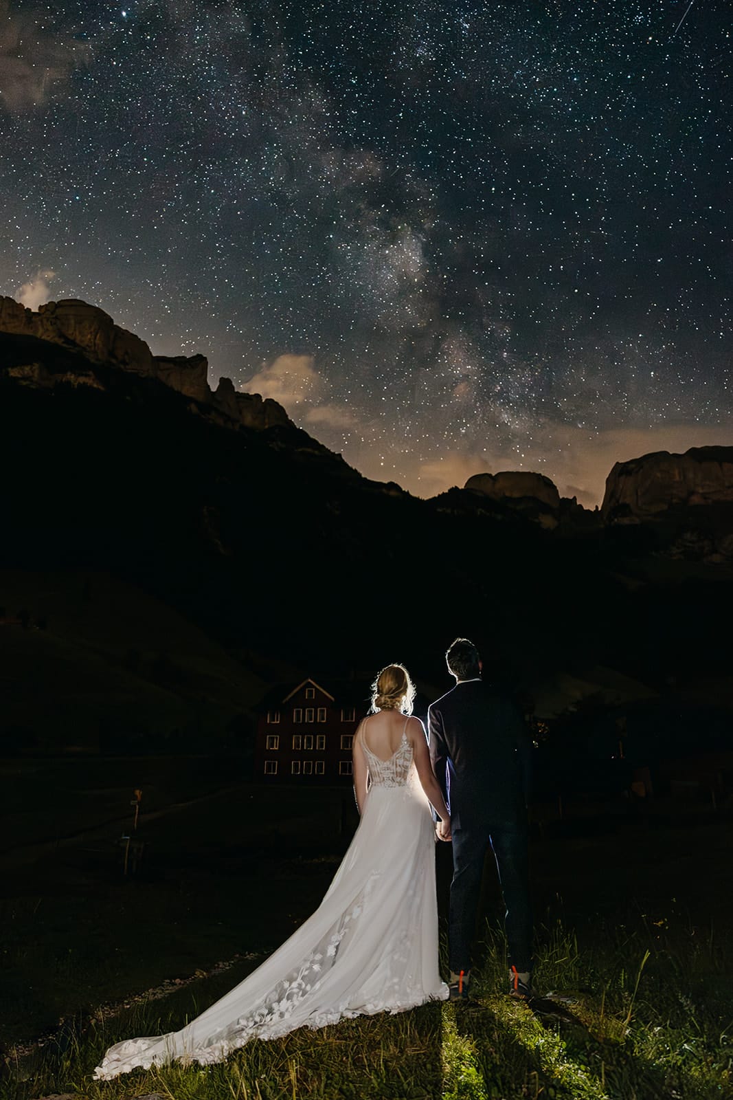 A couple admires the stars on their wedding night.