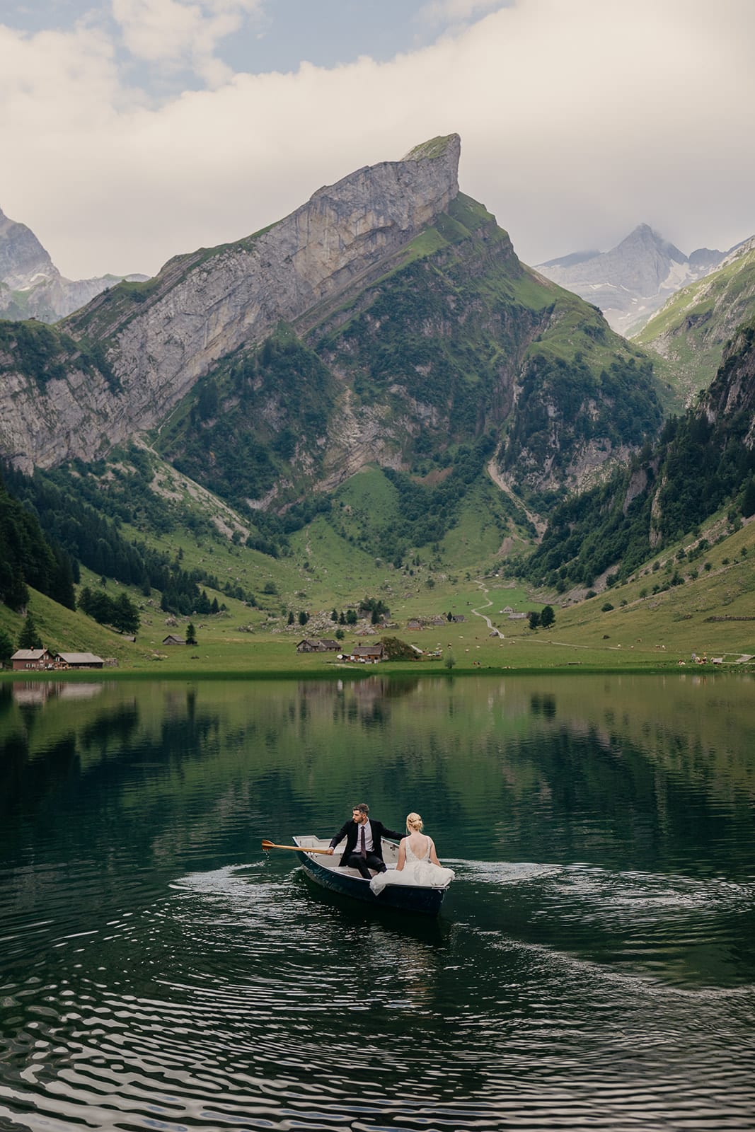 A groom paddles in lake seealpsee.