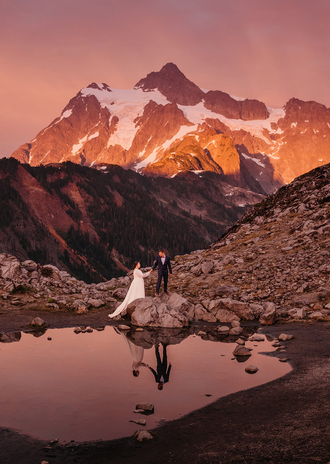 Bride and Groom walk around the tarn at Huntoon Point.